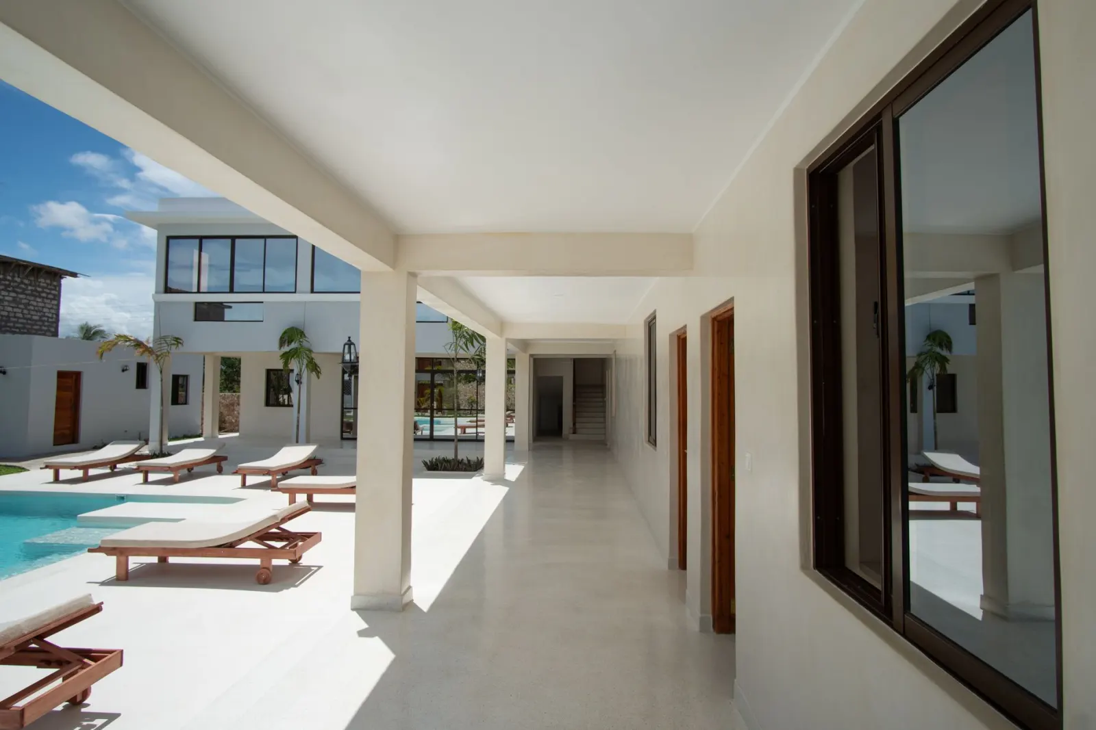 The shaded veranda at TAWI looking out over the courtyard pool in Watamu